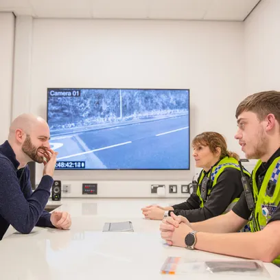 Two student police officers taking part in a mock police station interview with a suspect