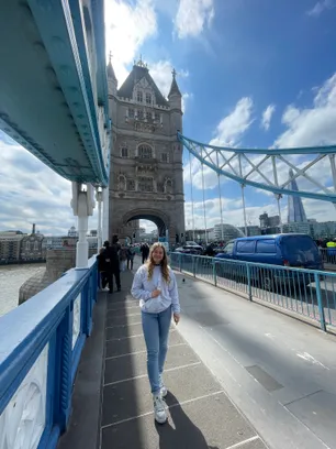 Canadian student, Ciera, smiling at the camera on Tower Bridge in London