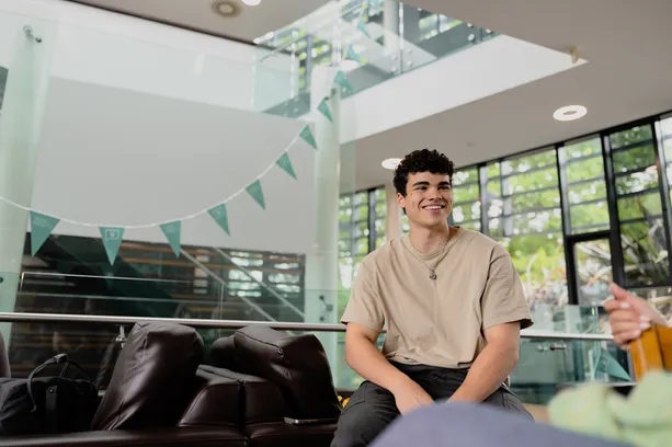 student sat on campus in treforest