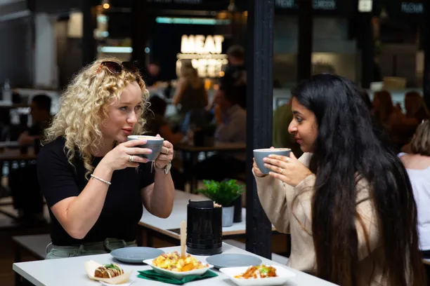 Two friends enjoy a coffee