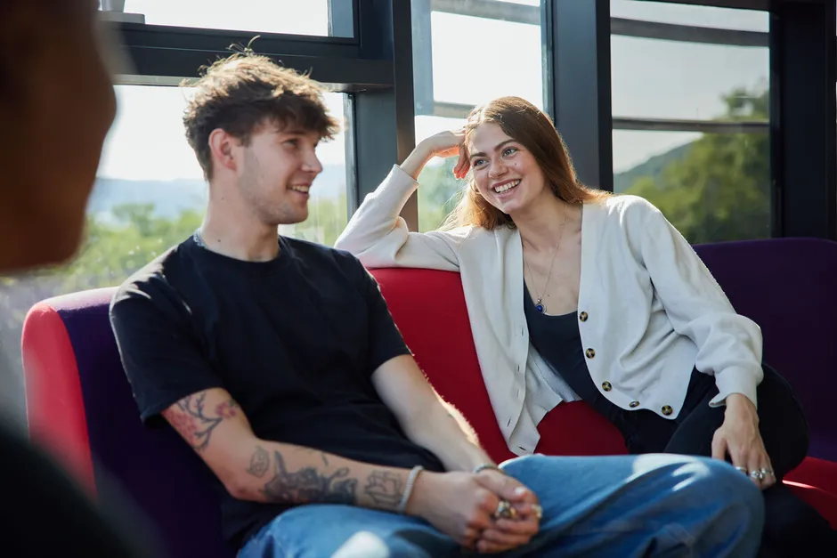 two students laughing in the students union