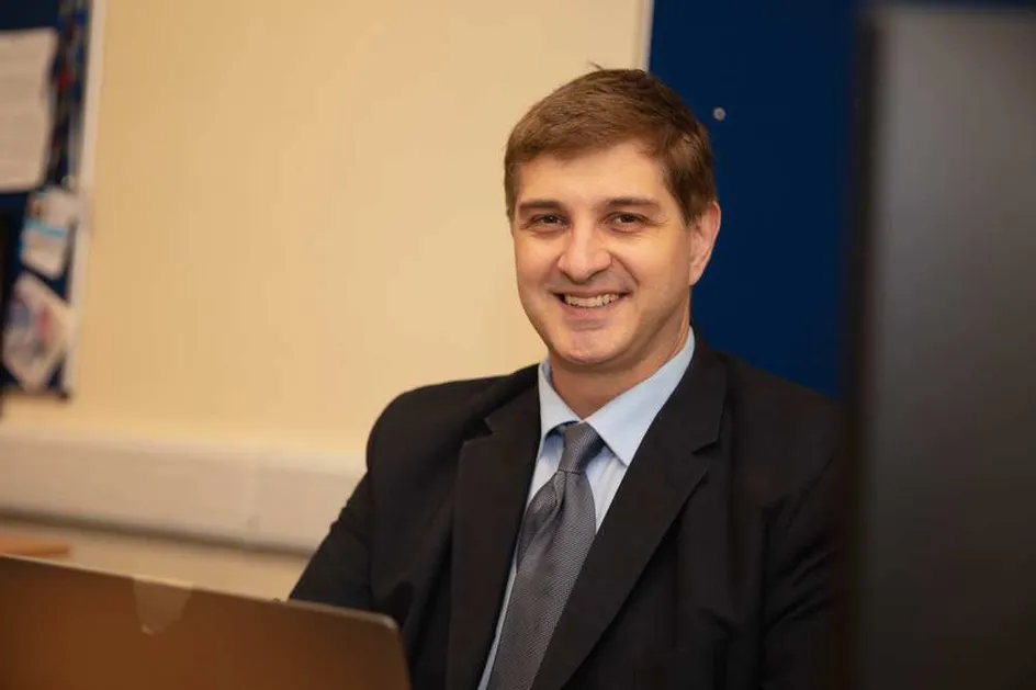 Christian Kaunert wearing a suit and smiling at the camera