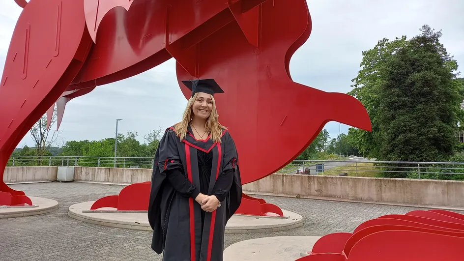 Abbi Smith in her graduation cap and gown