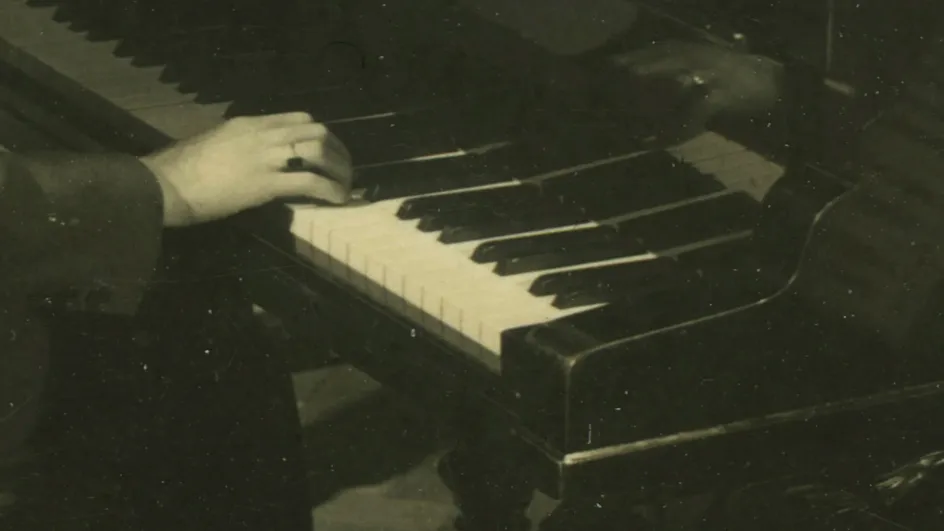 A still of hands playing the piano