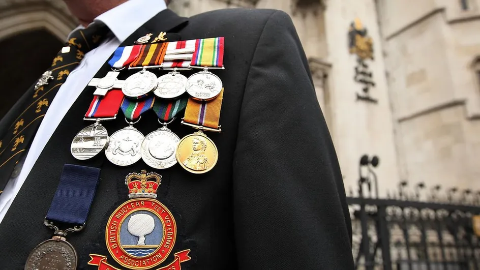 A war veteran showing his medals
