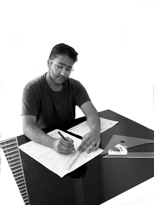 Yahya Jeebhai working on interior design briefs