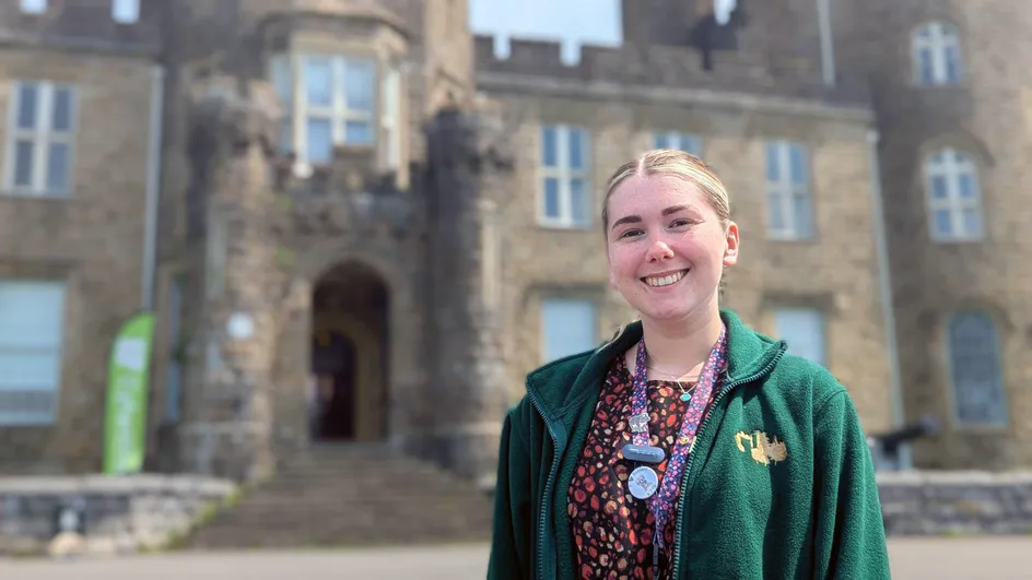 History graduate Charlotte Barry stands outside Cyfarthfa Castle