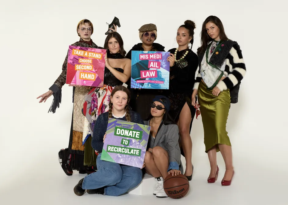 Fashion students pose in various outifts in a studio