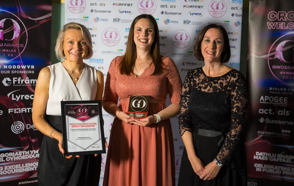 Colleagues smiling at the Go Awards Wales