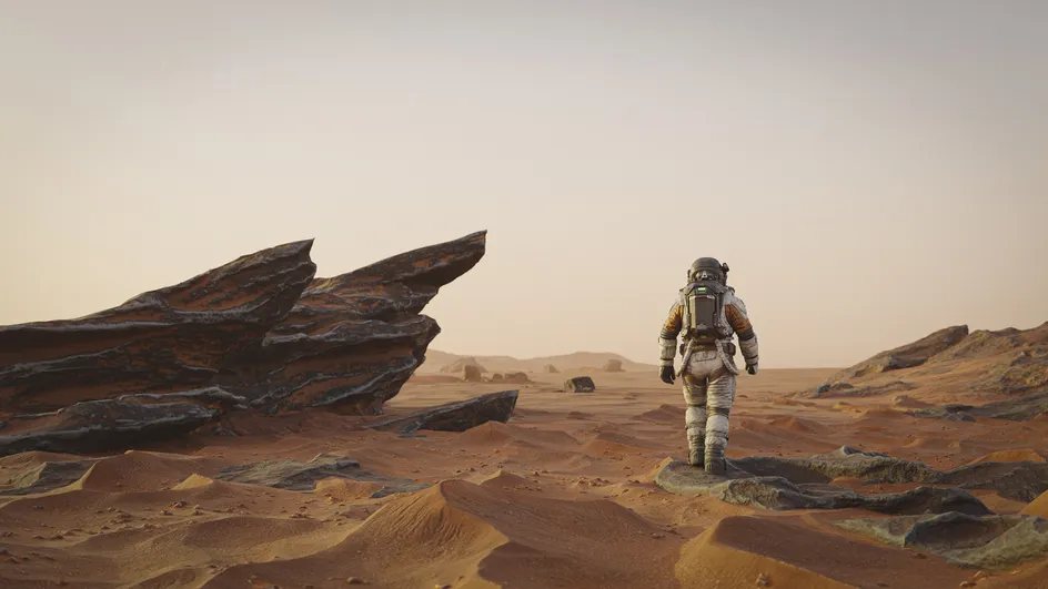 Darlun o syniad artist o astronaut yn cerdded ar arwyneb Mawrth