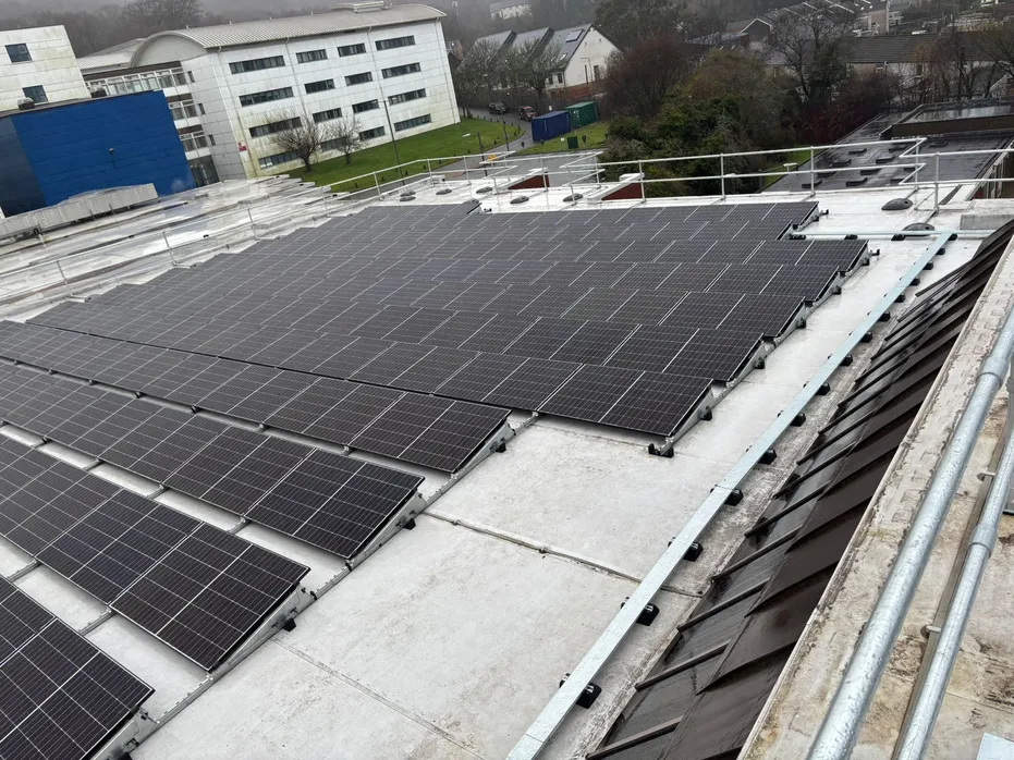 Solar panels installed on a university building roof.