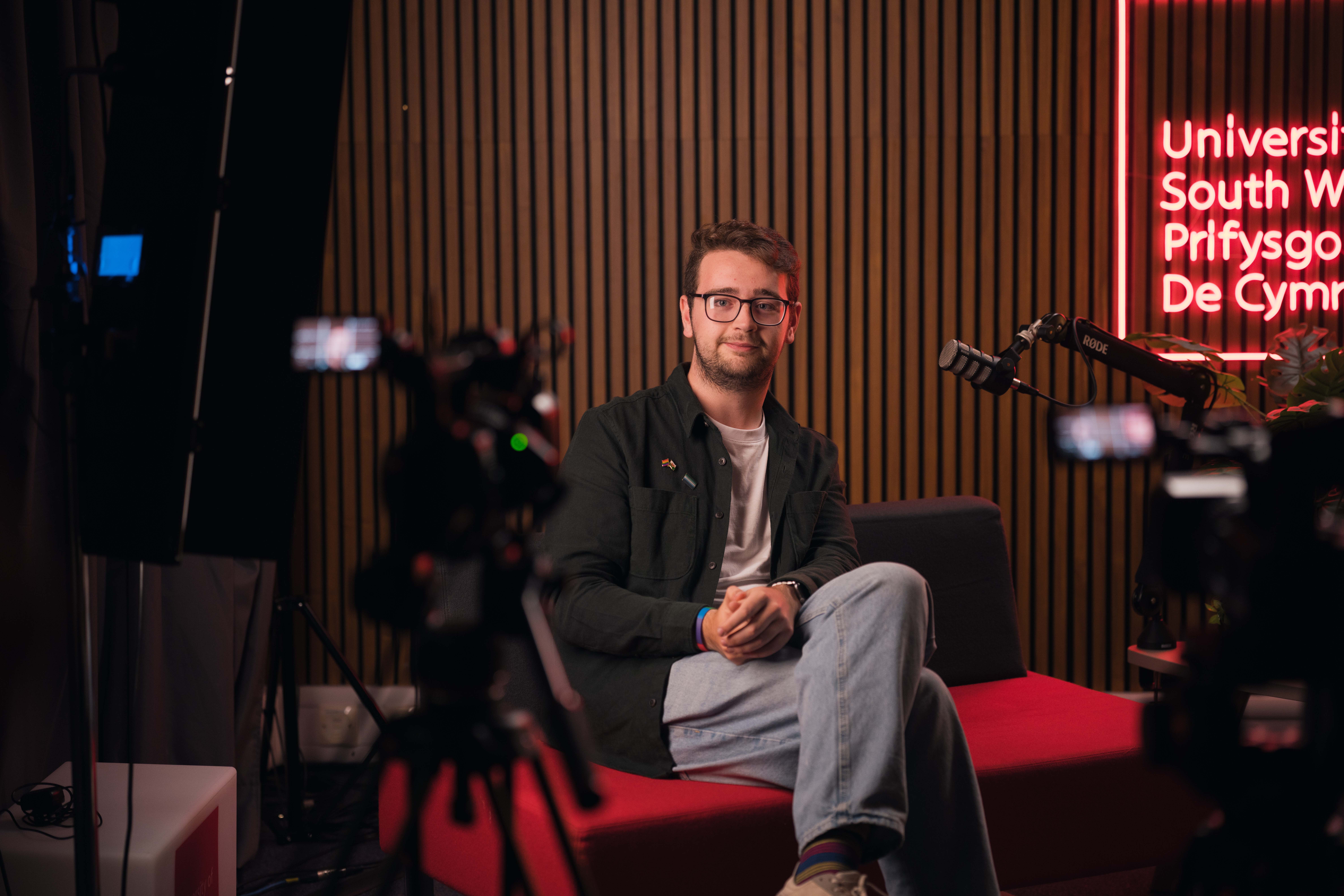 USW Cardiff podcast studio in use with guest, boom microphone and cameras