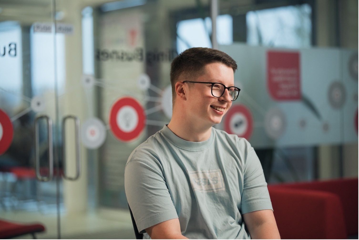 Business student Joel smiles for a profile shot