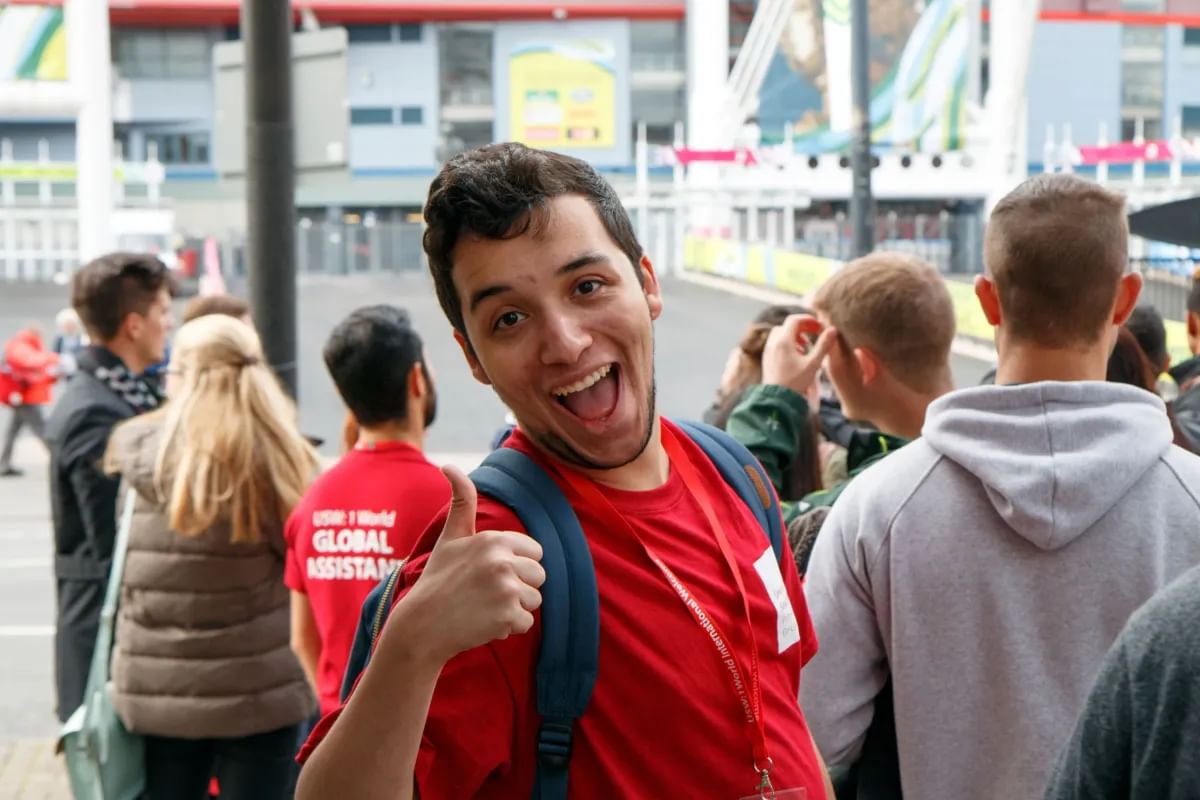student ambassador on international welcome week walking tour of cardiff smiling to the camera