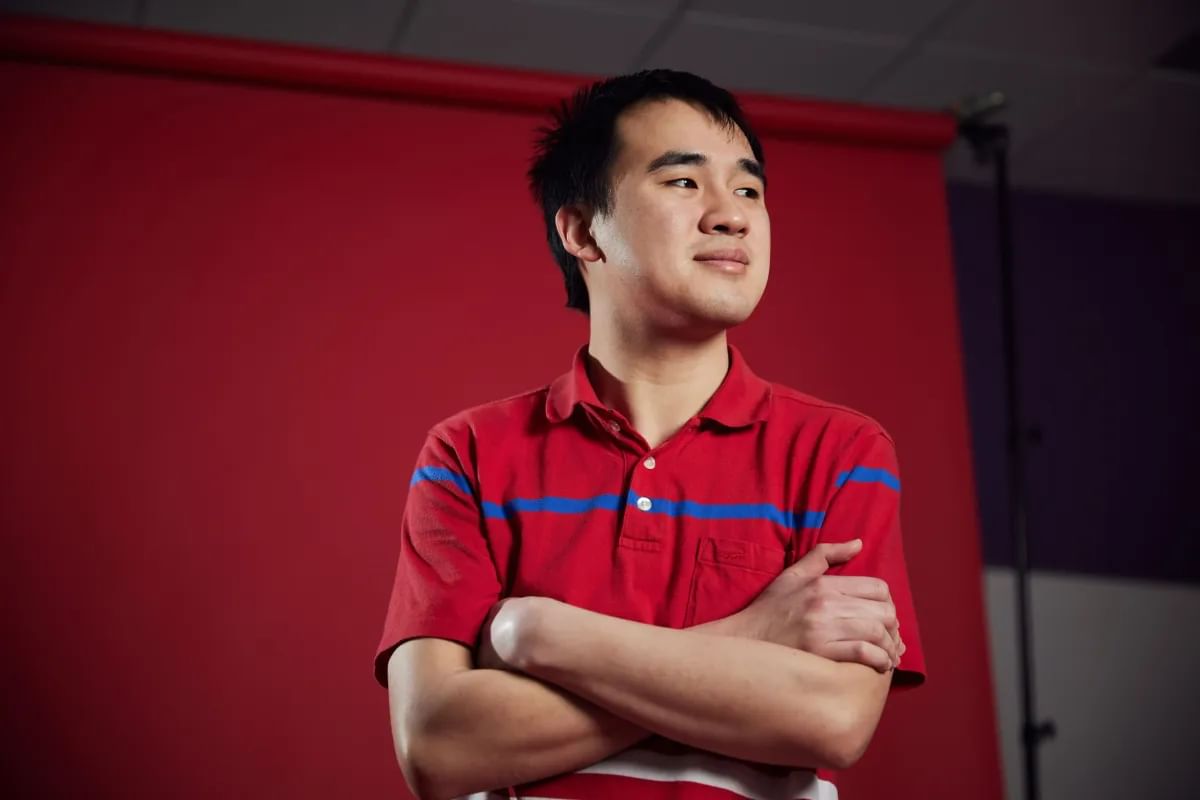 Accounting student, Kee Hau, looks off camera during a photoshoot