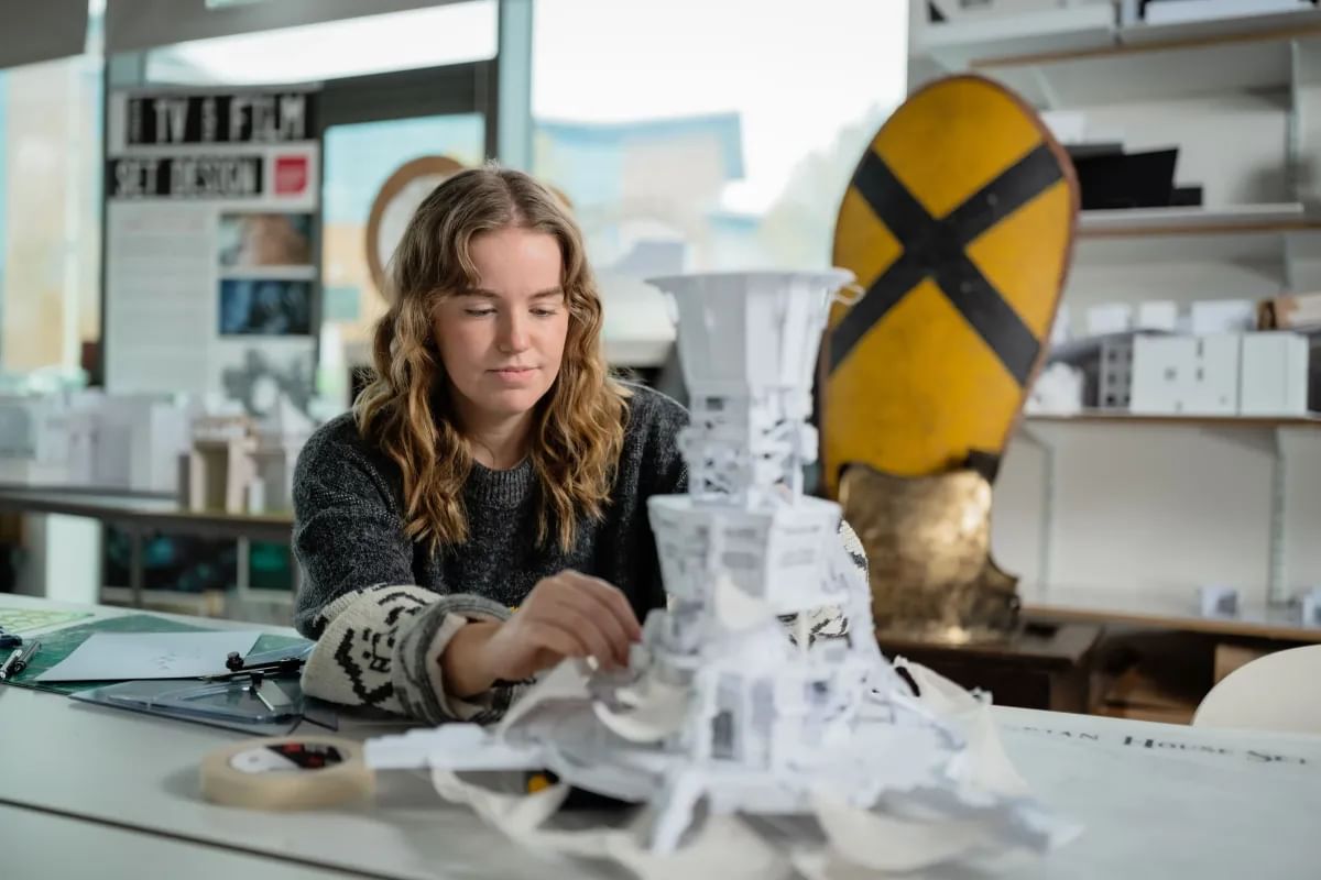 Kirsty working on a paper model