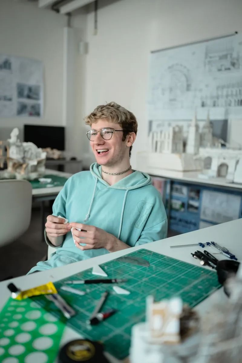 TV and Film Set Design student smiling away from camera