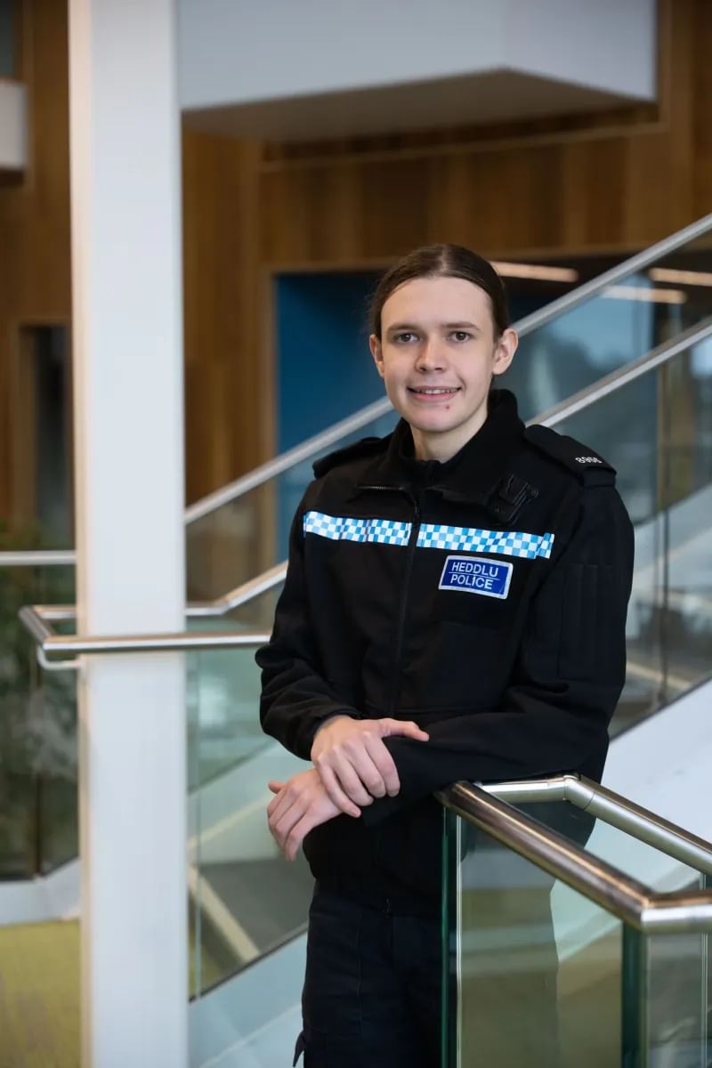 Professional Policing graduate, Layla, poses for a profile picture whilst wearing their South Wales police uniform