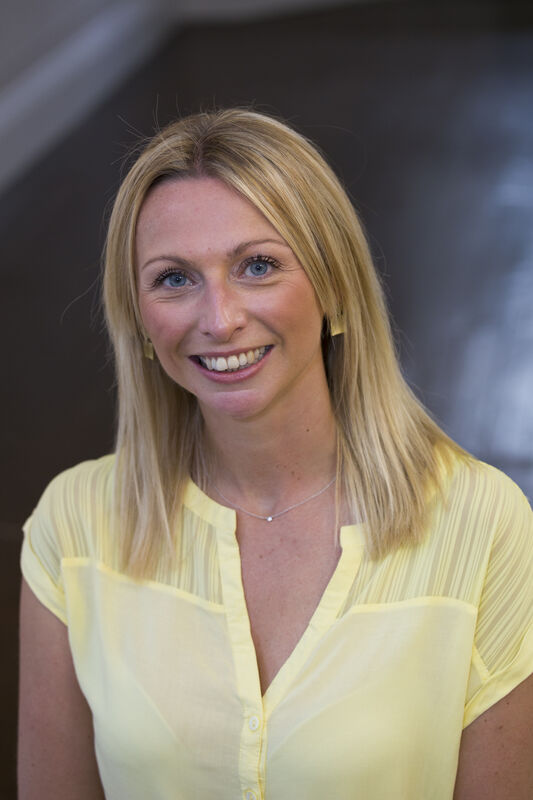 A photo of Sally Fairburn smiling at the camera