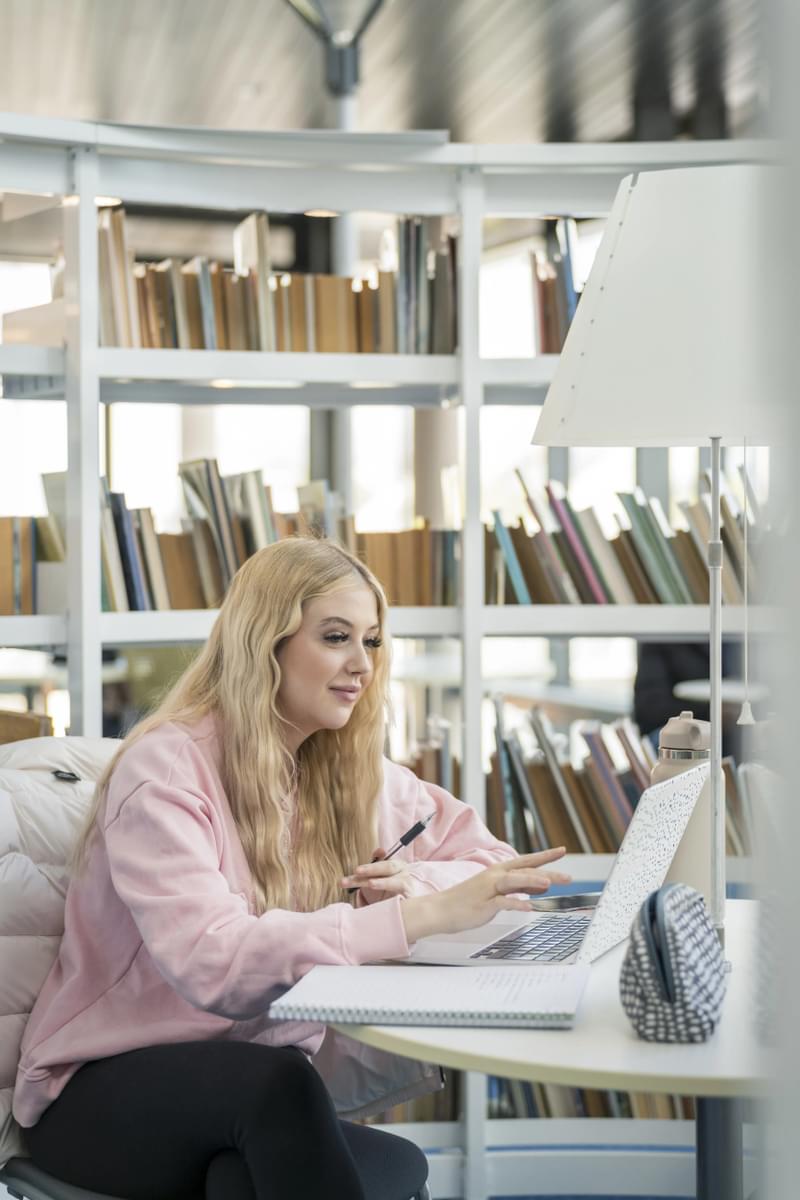 Student studying in the library at Newport campus