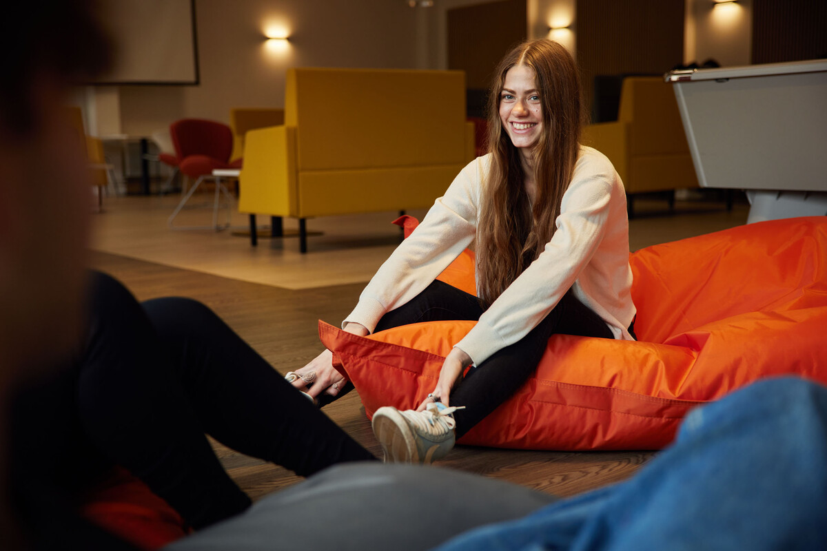A student sat on beanbags in the accommodation hub.