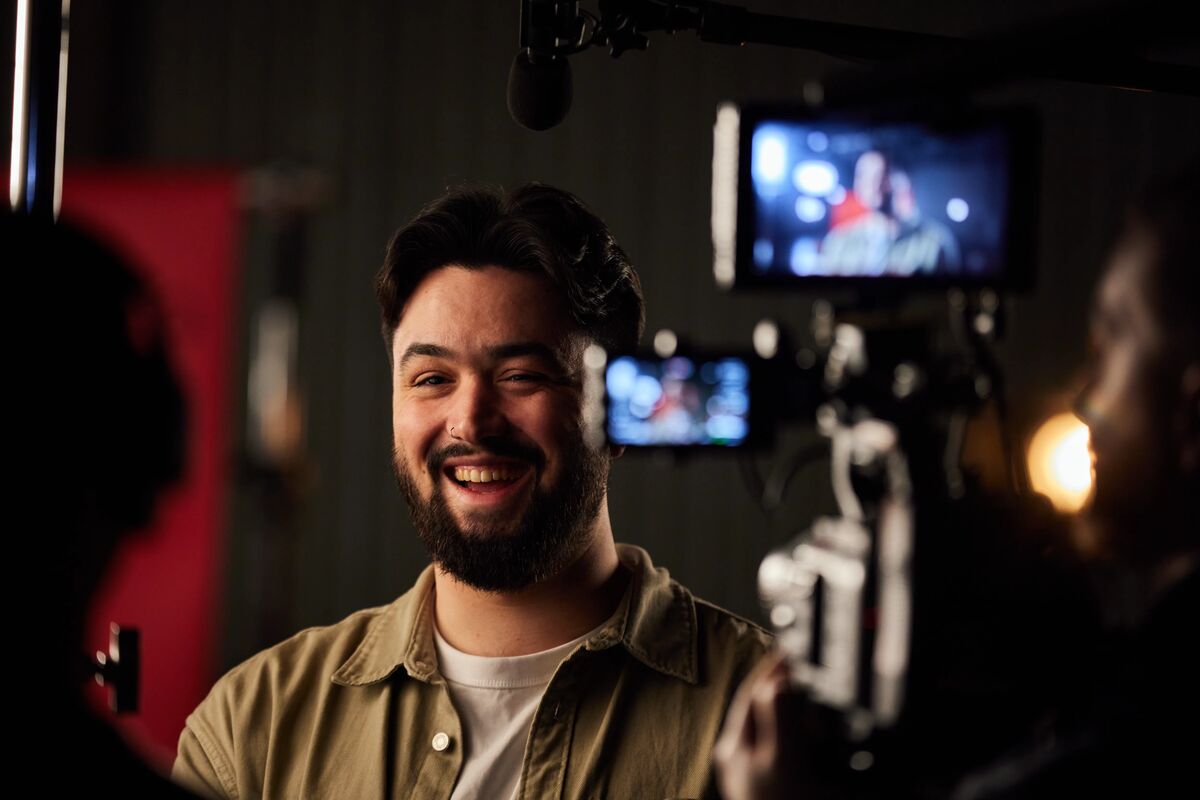 Graduate Savva smiles slightly off camera during a case study photoshoot