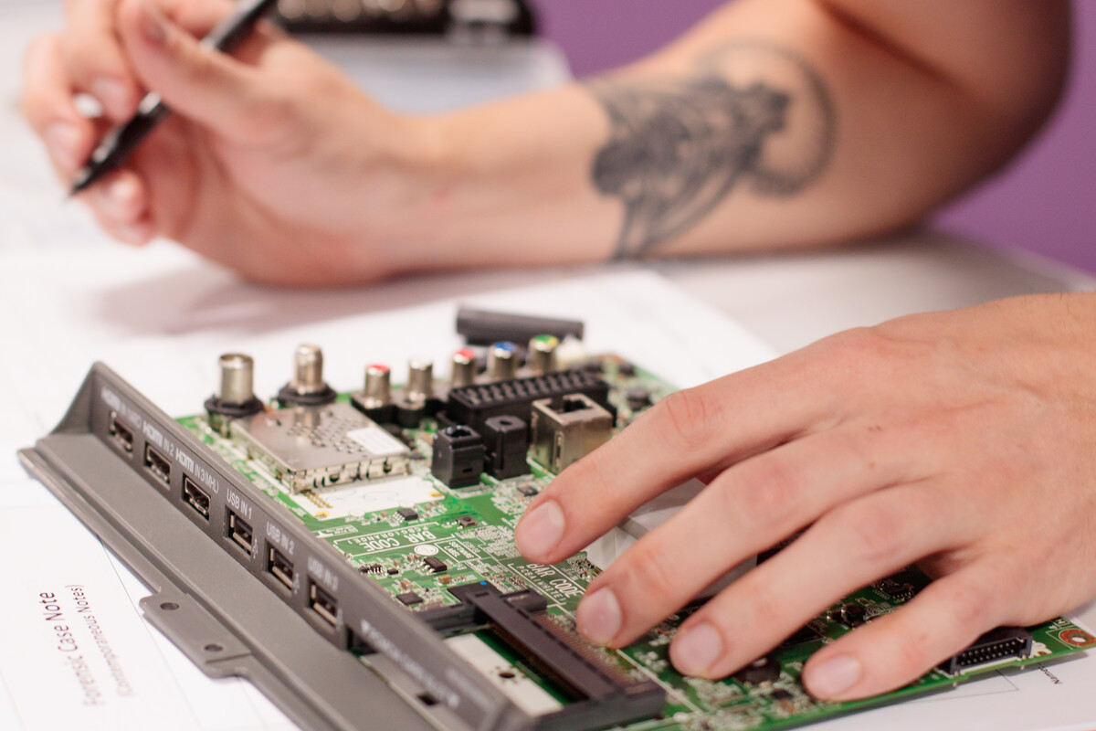 image of someone working with electronic board