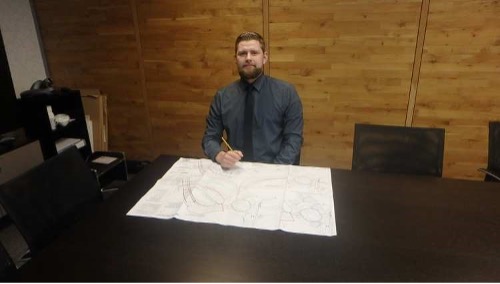 Student Craig sat at a table with a planning document in front of him