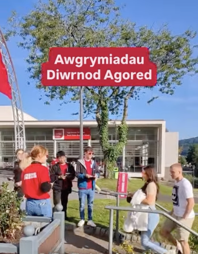 A group of open day visitors looking at facilities in the Cardiff campus. The title reads 