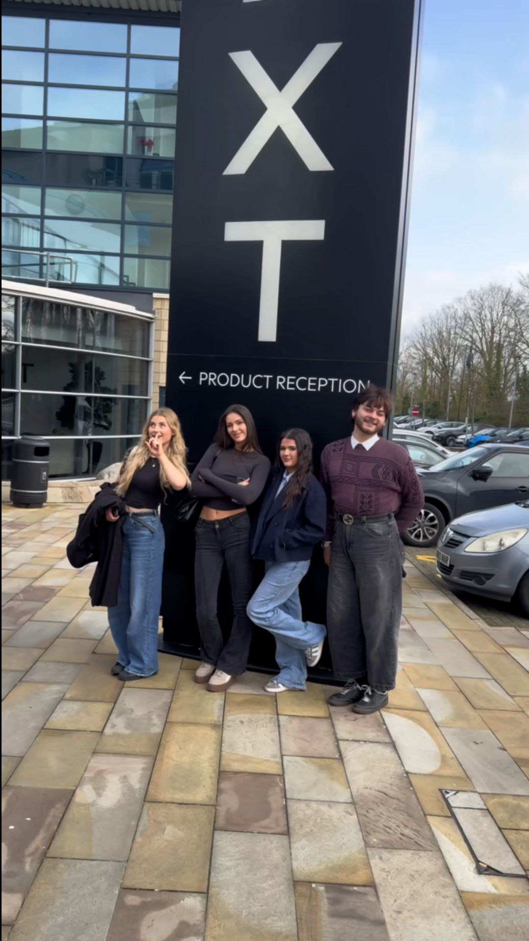 Four Fashion students standing outside Next HQ