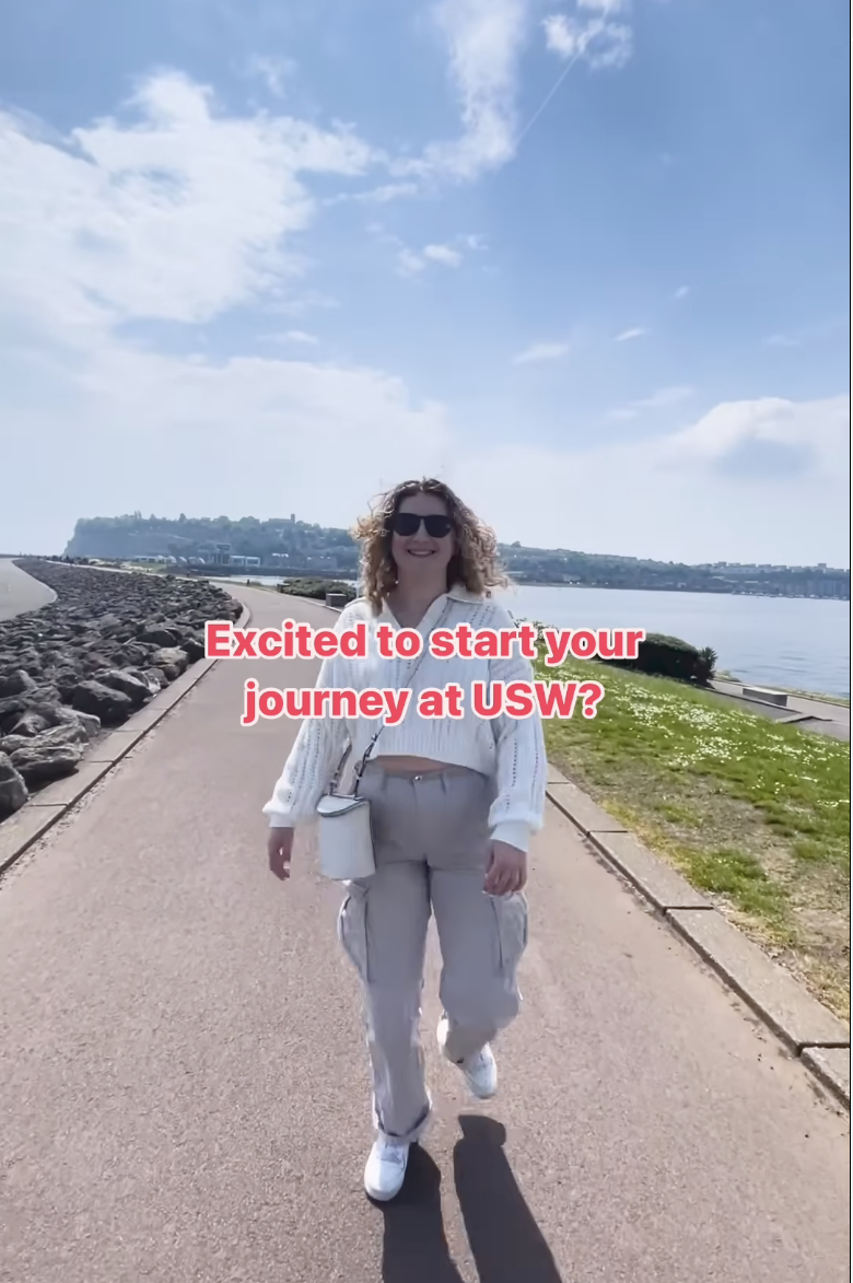 screenshot of a social video titled 'excited to start your journey at USW?' - a student walking across the Cardiff Bay Barrage