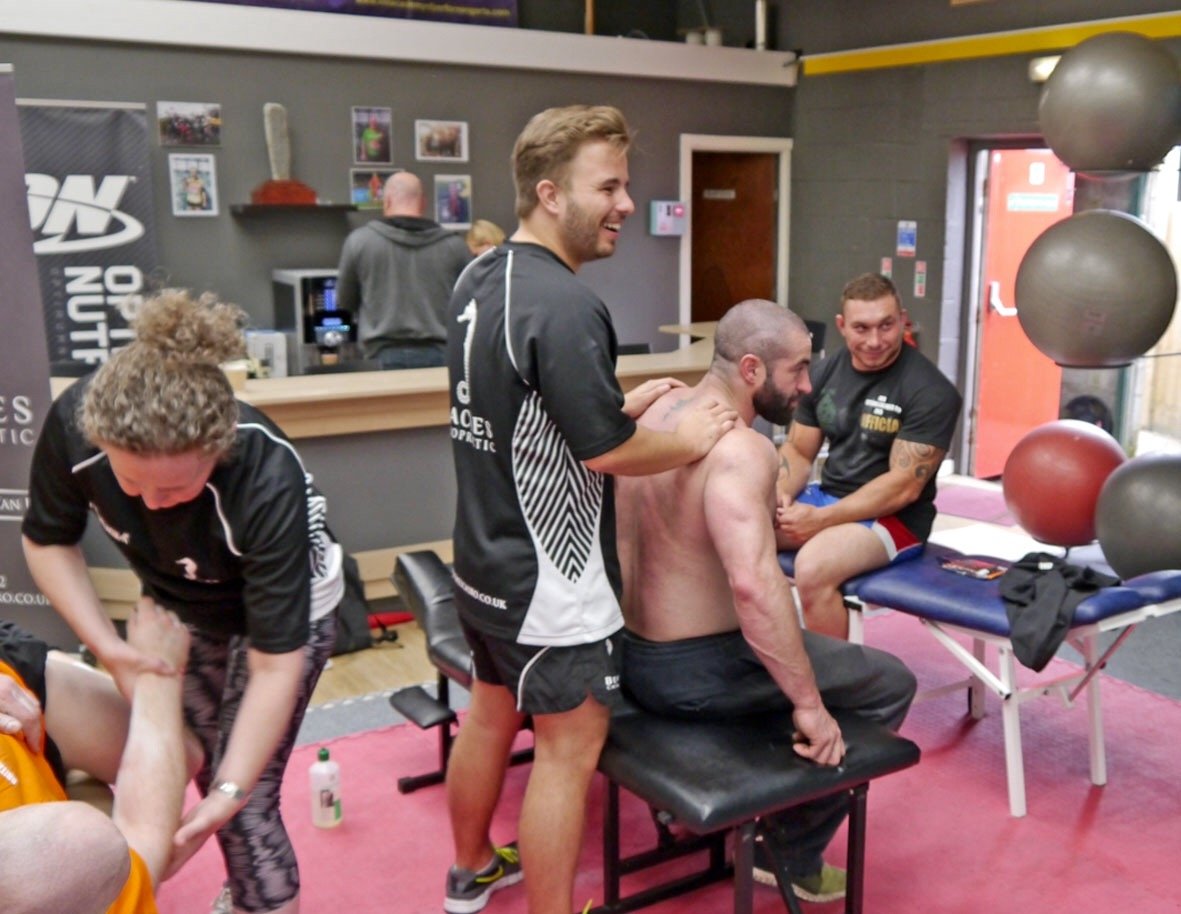 Daniel Morgan working in chiropractic clinic