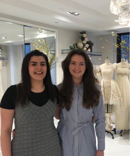 Fashion students Elisedd and Anna pose for a photo during their placement at couture designer Randi Rahm in New York