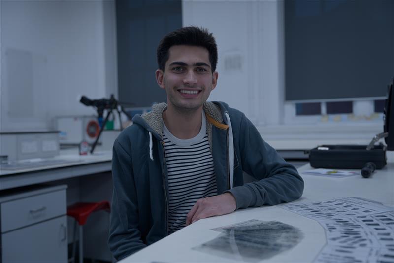 Forensic Science student, Jakob,sat at a desk in the labs on Glyntaff campus