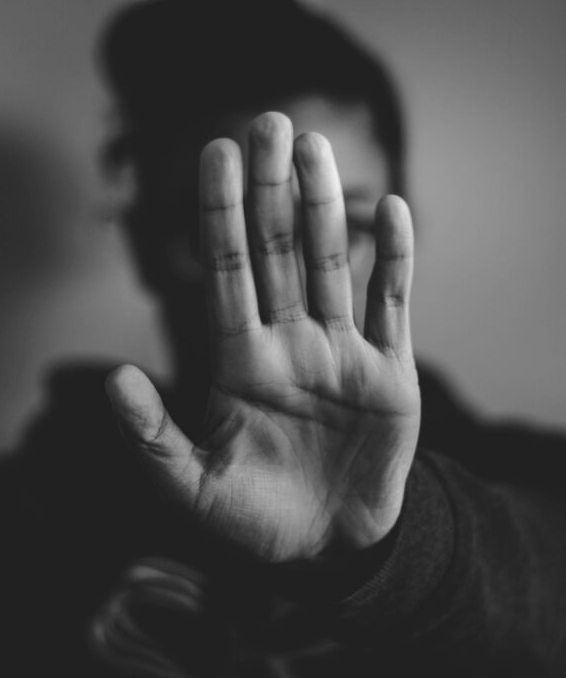 Women with hand directed at camera
