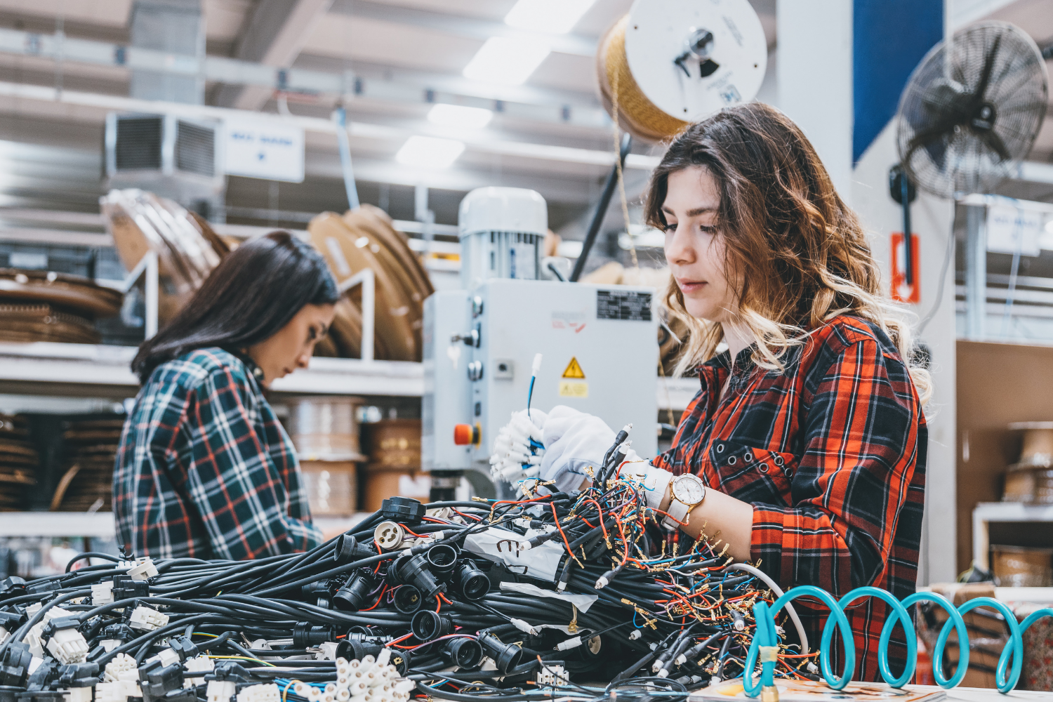University students working with machine parts