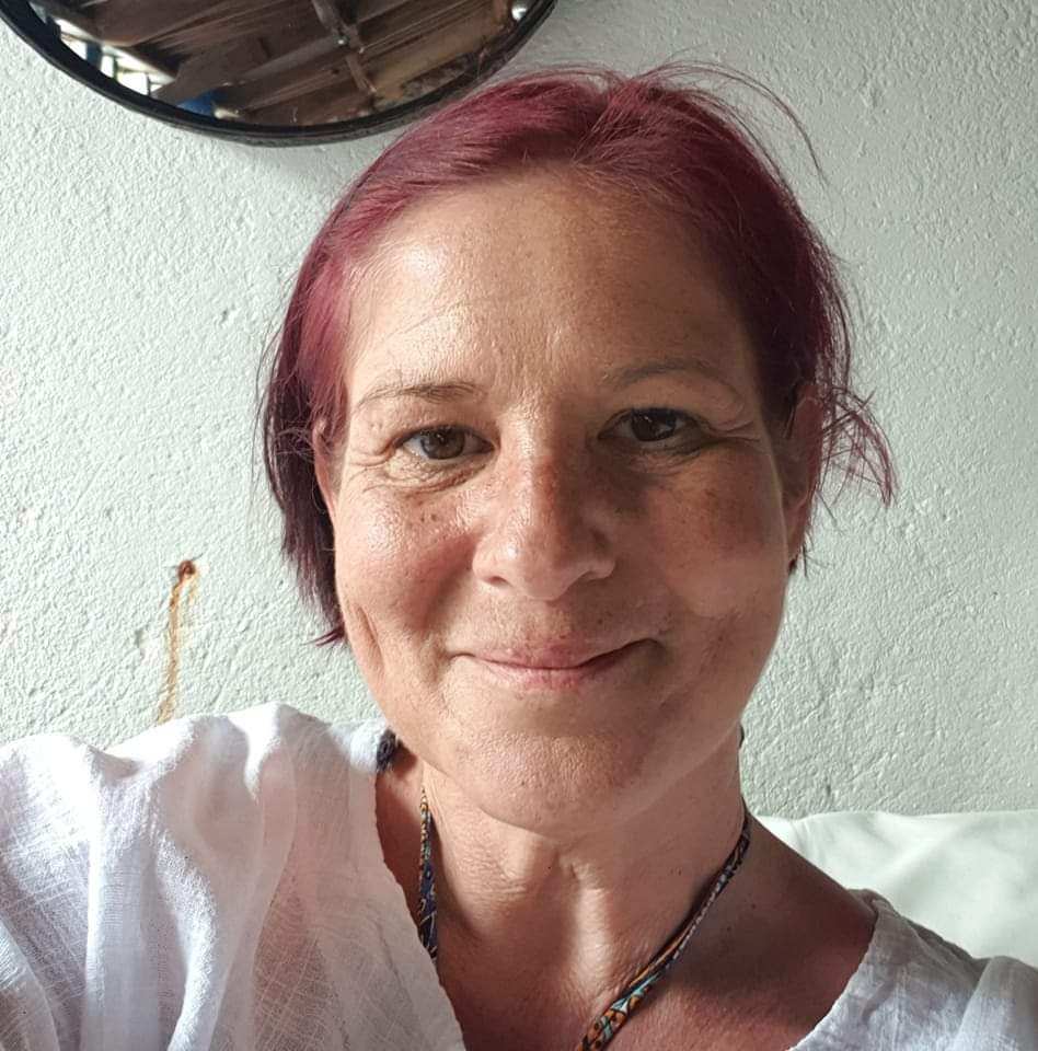 Emma Kwaya-James smiles at the camera while taking a selfie